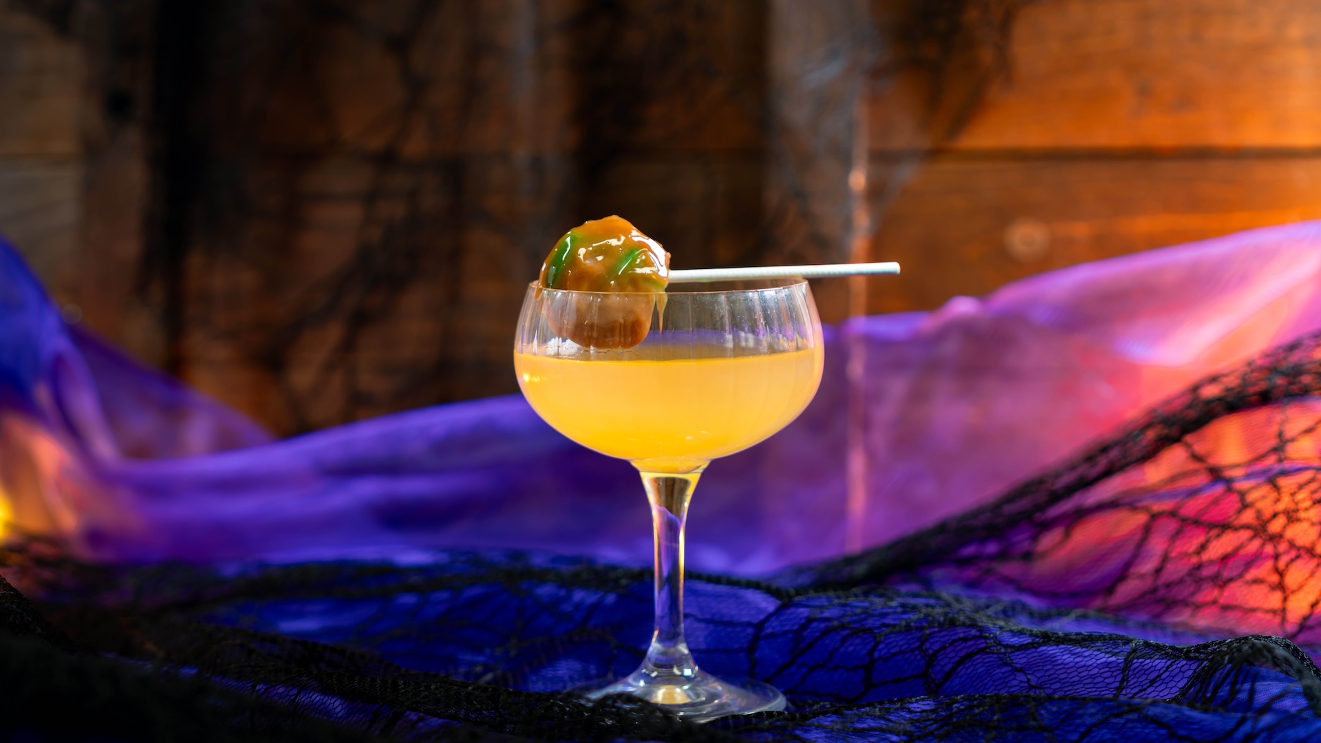 Caramel Apple Martini: Kissed Caramel Smirnoff Vodka, Bols Butterscotch Liqueur, sour apple juice, and a caramel apple lollipop (New)