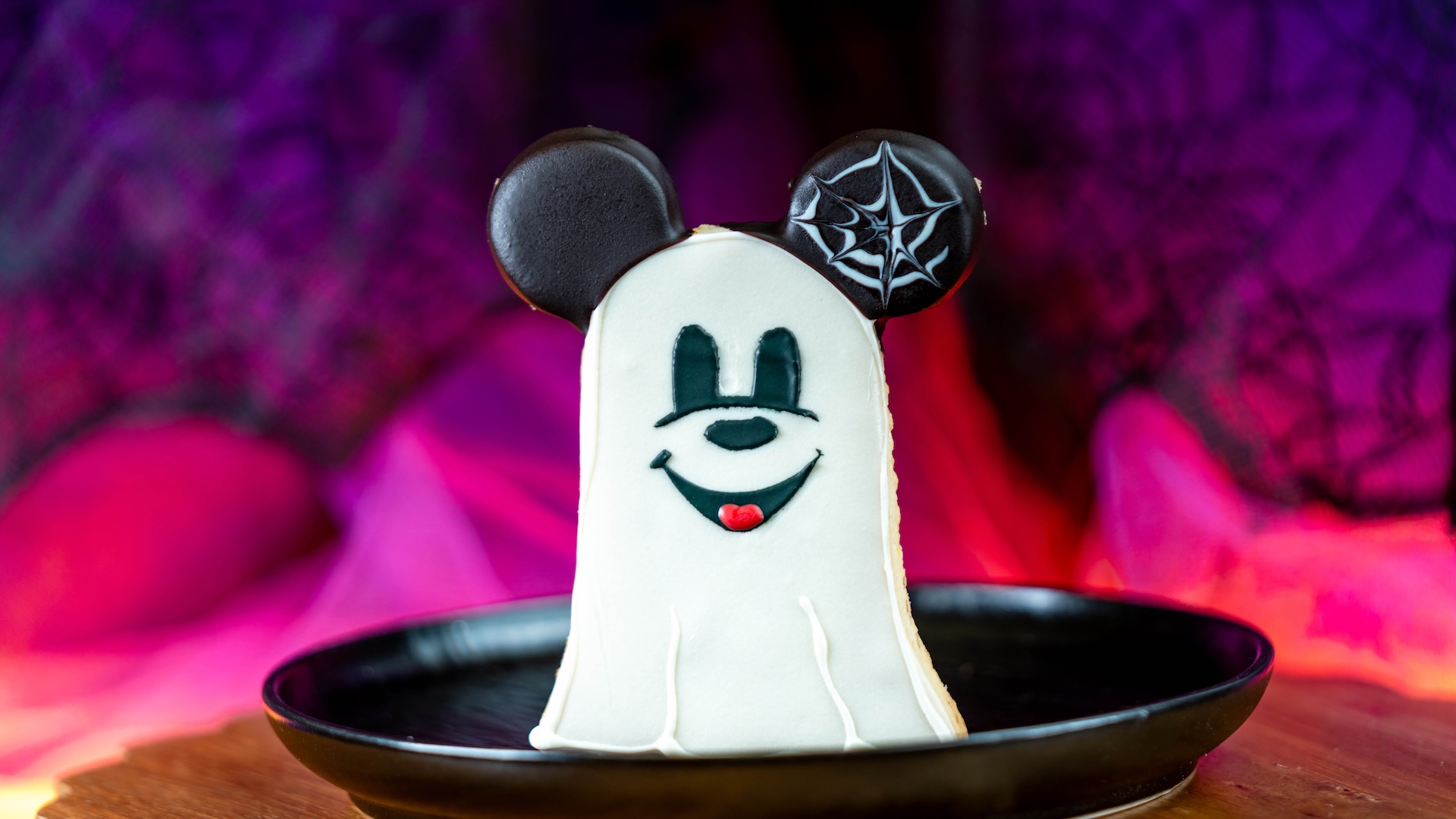 Mickey-shaped Ghost Cookie: Shortbread cookie dipped in chocolate (Available Aug. 18 through Oct. 31) (New)