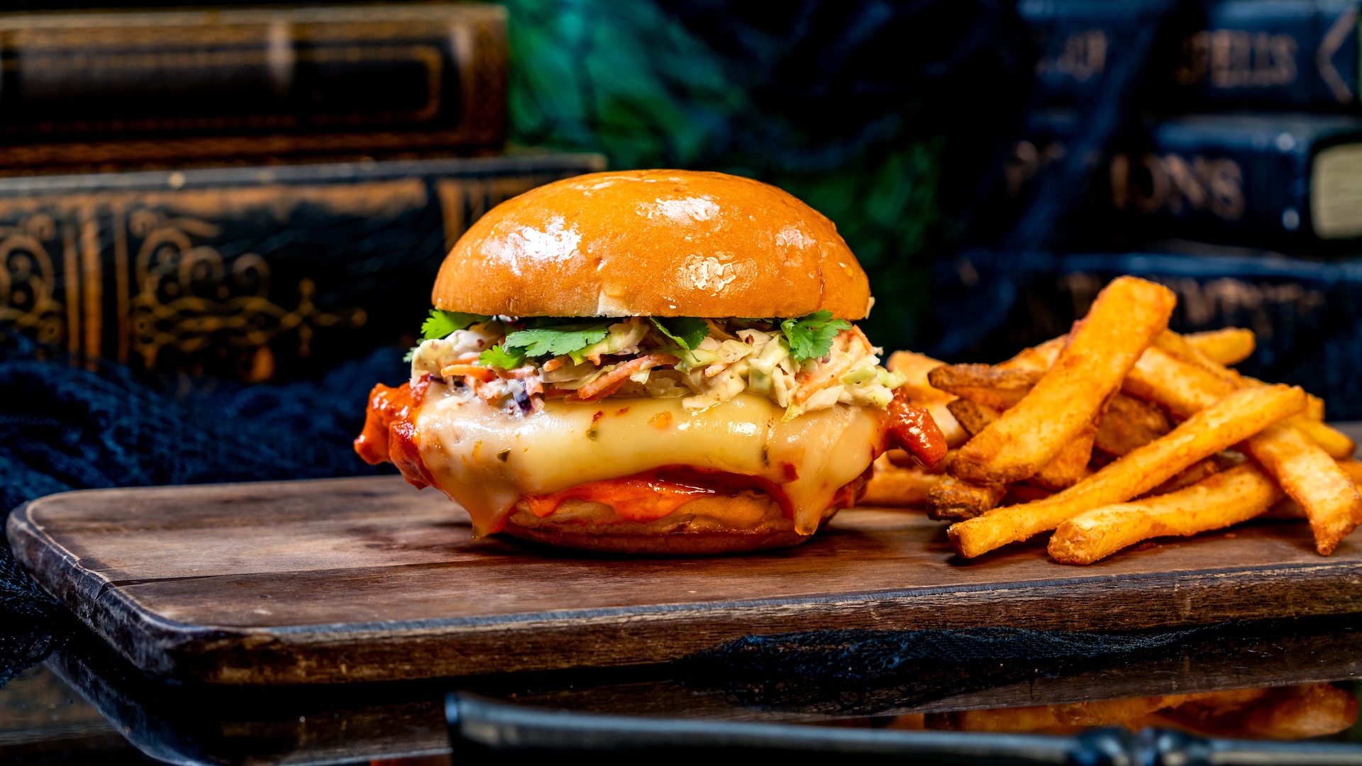 Spicy Chicken Sandwich: Panko-breaded fried chicken breast tossed in spicy chile sauce with pepper jack and mustard slaw served on a brioche bun