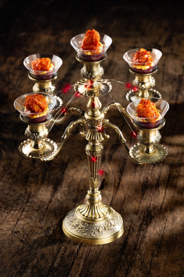 Candelabra Eggs: Deviled eggs with crispy fried chicken, sweet-and-tart pepper sauce, and aji amarillo custard (New)