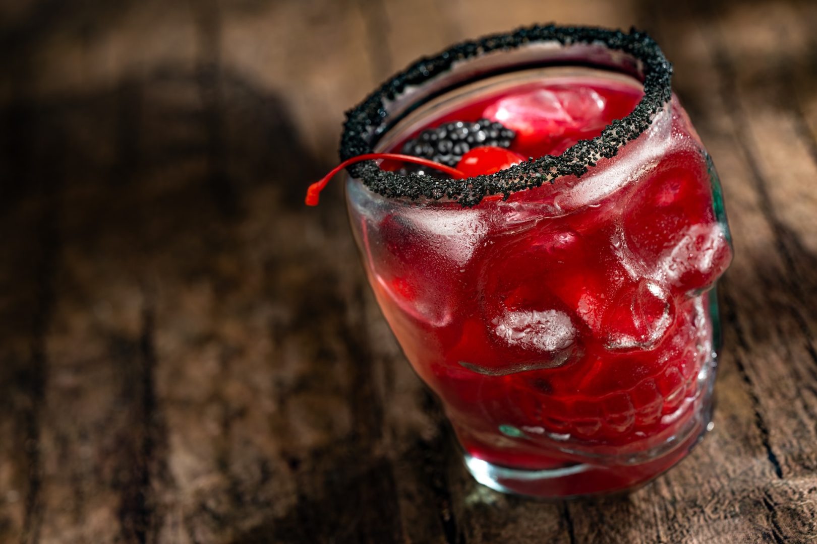 Temple of Doom Margarita: Patrón Silver Tequila, Bols Blackberry Brandy, blackberry purée, habanero-lime syrup, and lime juice topped with a black sugar rim, blackberries, and cherries (New)