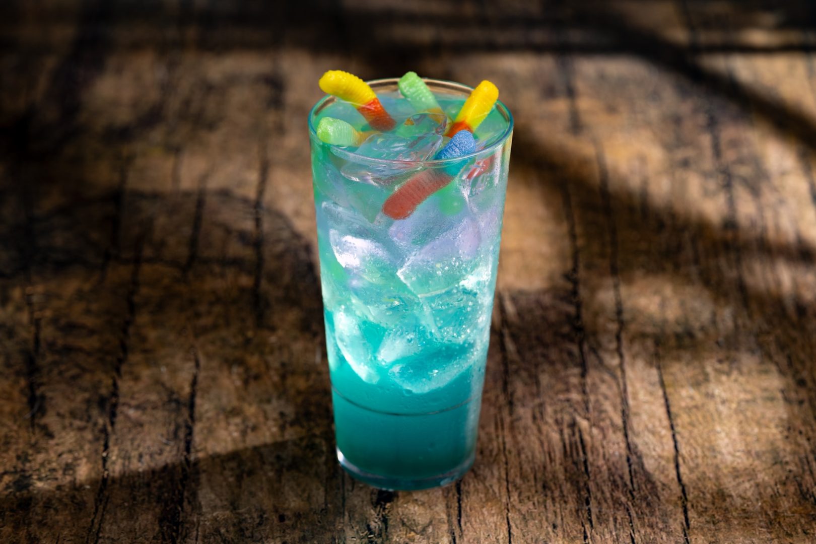 Viper’s Nest: DOLE Pineapple Juice, white cranberry juice, green apple syrup, blue curaçao syrup, Sprite, and butterfly pea extract topped with green apple juice-filled pearls and gummy candy (New)