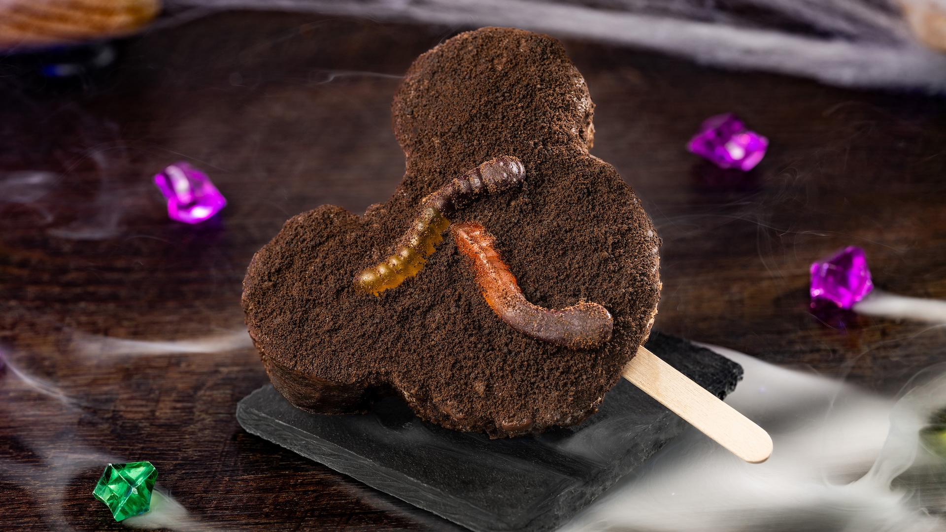 Mickey Dirt 'n Worms Cereal Treat: Cookies 'n cream-flavored crisped rice cereal treat with milk chocolatey coating, crushed chocolate cookies, and gummy worms (New) 
